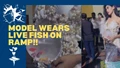Woman Wears Live Fish on the Ramp (Watch Video)